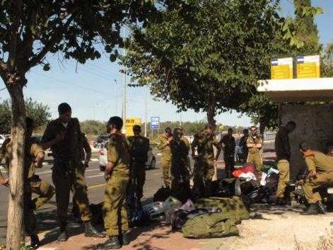 Most Israelis, seeing combat soldiers at a bus station, will probably think about the hardships of combat service, and feel sympathy and pride (credit – Esti Tsal)