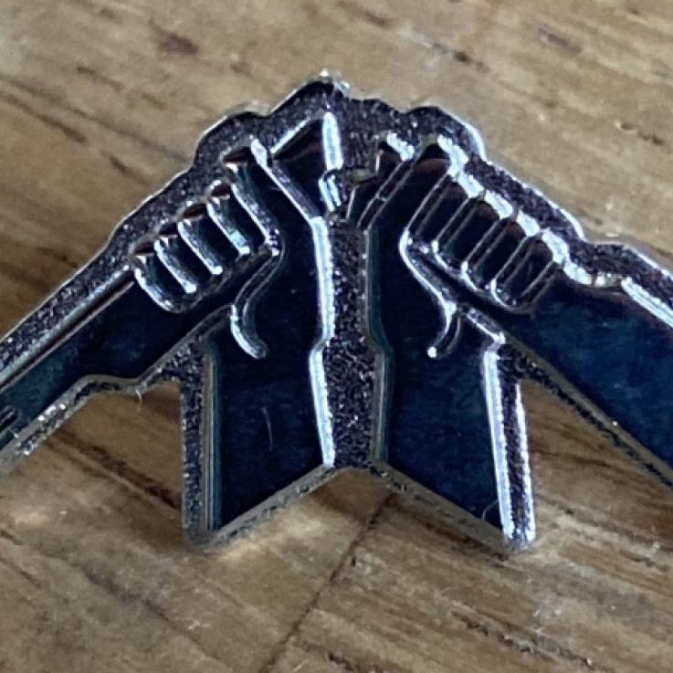 A Broken Rifle pin badge