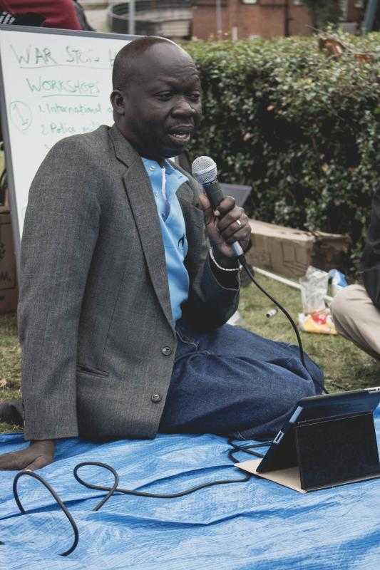 Moses John Monday speaking at the seminarabout armed violence in South Sudan