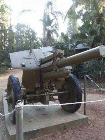 A decommissioned piece of artillery in a public park next to a playground (credit – Diana Dolev)