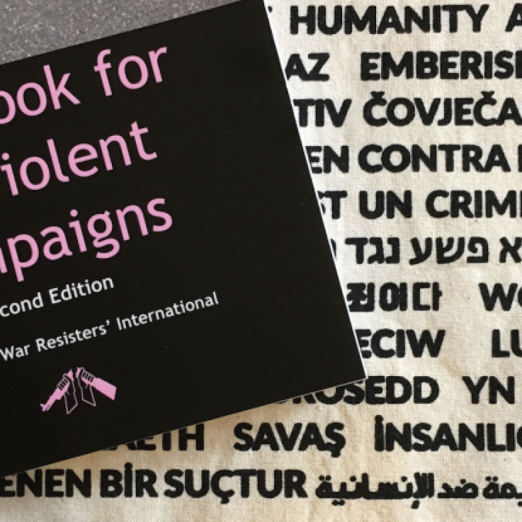 Image of the Handbook for Nonviolent Campaigns and a WRI tote bag