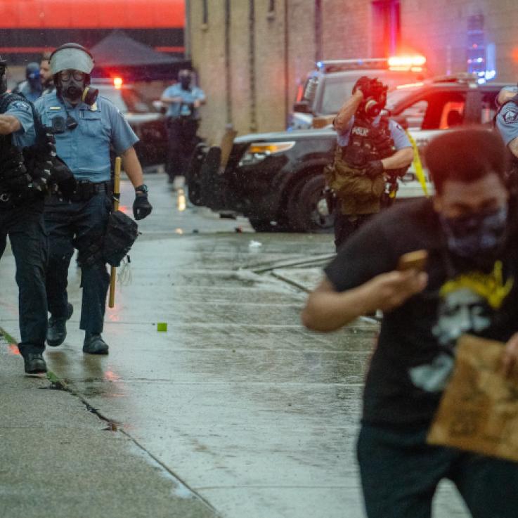   Minneapolis Police fire tear gas at those protesting the May 25th death of George Floyd.